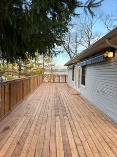 Spacious wooden deck extending from residential home
